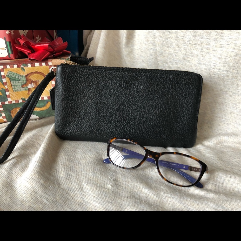 Authentic Coach black leather clutch